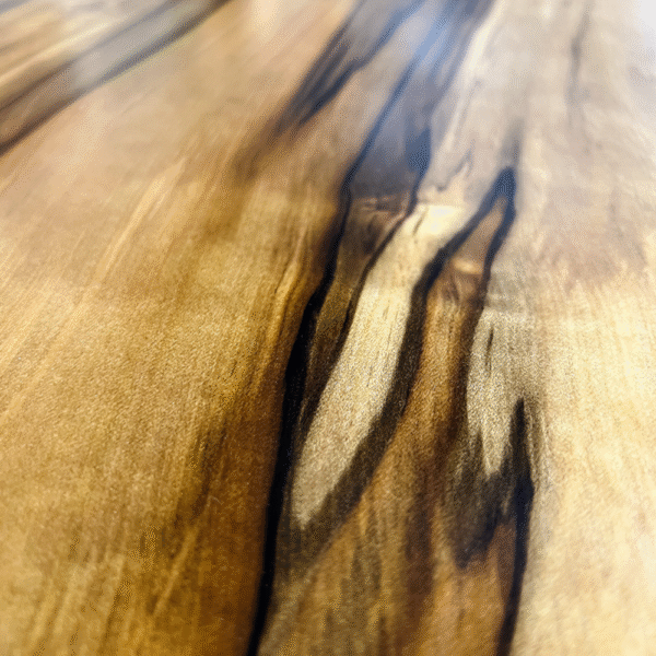 Detailed view of Blackheart Sassafras grain showing natural flame veining and soft tonal colouring