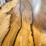 Close-up of charcoal veining and grain patterns in Blackheart Sassafras timber