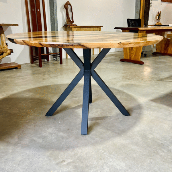 Blackheart Sassafras round dining table displayed in the Timbercraftsman Gallery Showroom in Eumundi