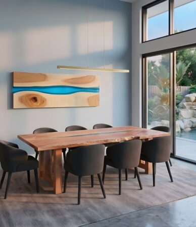 dining room with timber table, artwork and sideboard cabinet overlooking water feature and swimming pool through large sliding glass doors and windows